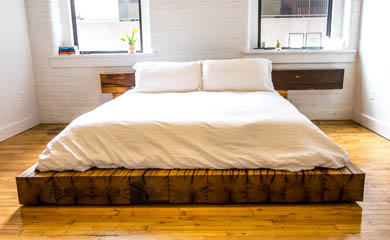 a bedframe made of reclaimed oak